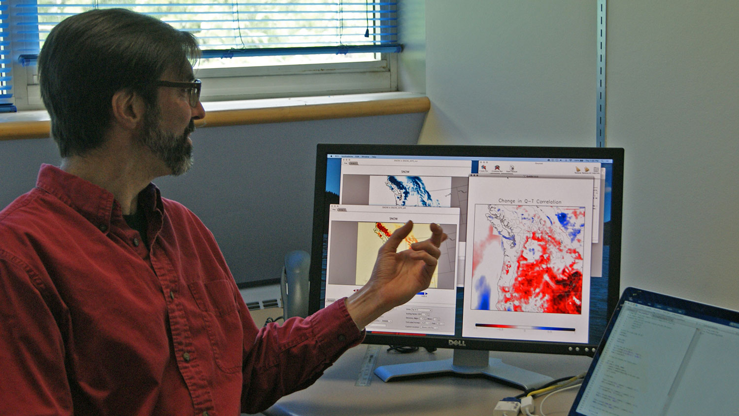 Eric Salathé, a professor of climate science at the University of Washington Bothell School of STEM, points to results from the WRF regional climate model.