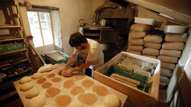 Baker Damien makes bread in western France.