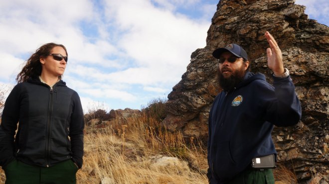 Carly Reed and Jeff Bouschor surveying the burn area.