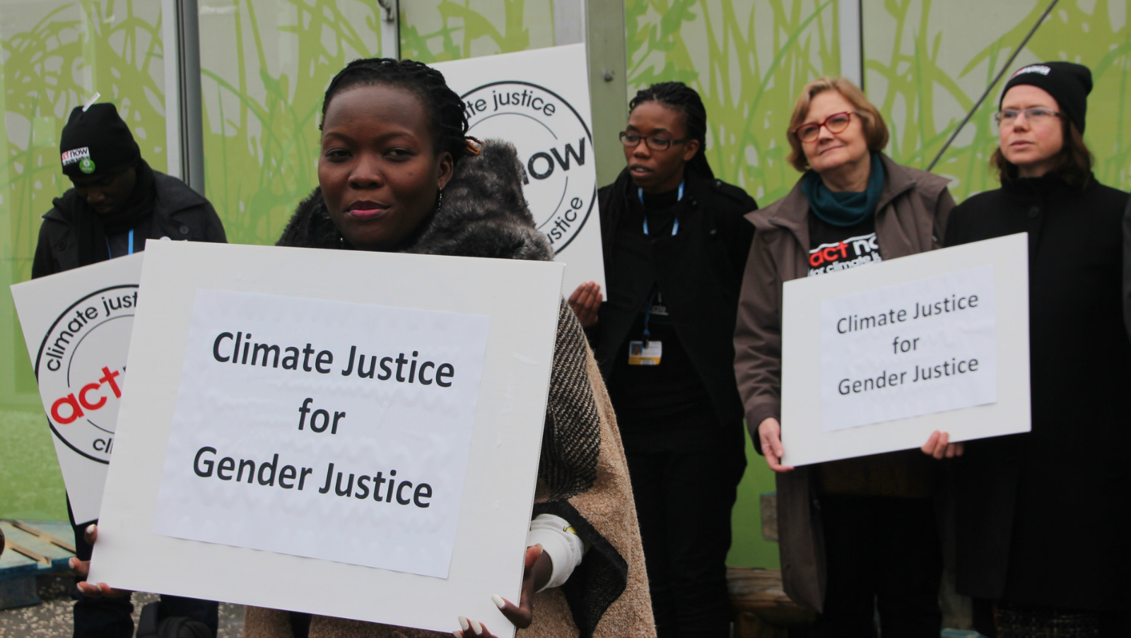 activists with signs: "climate justice for gender justice"