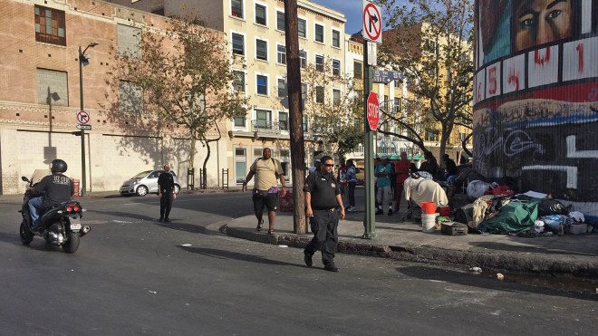 Private security officer Patton patrols Crocker and 5th in the Skid Row area of Los Angeles, Calif. 