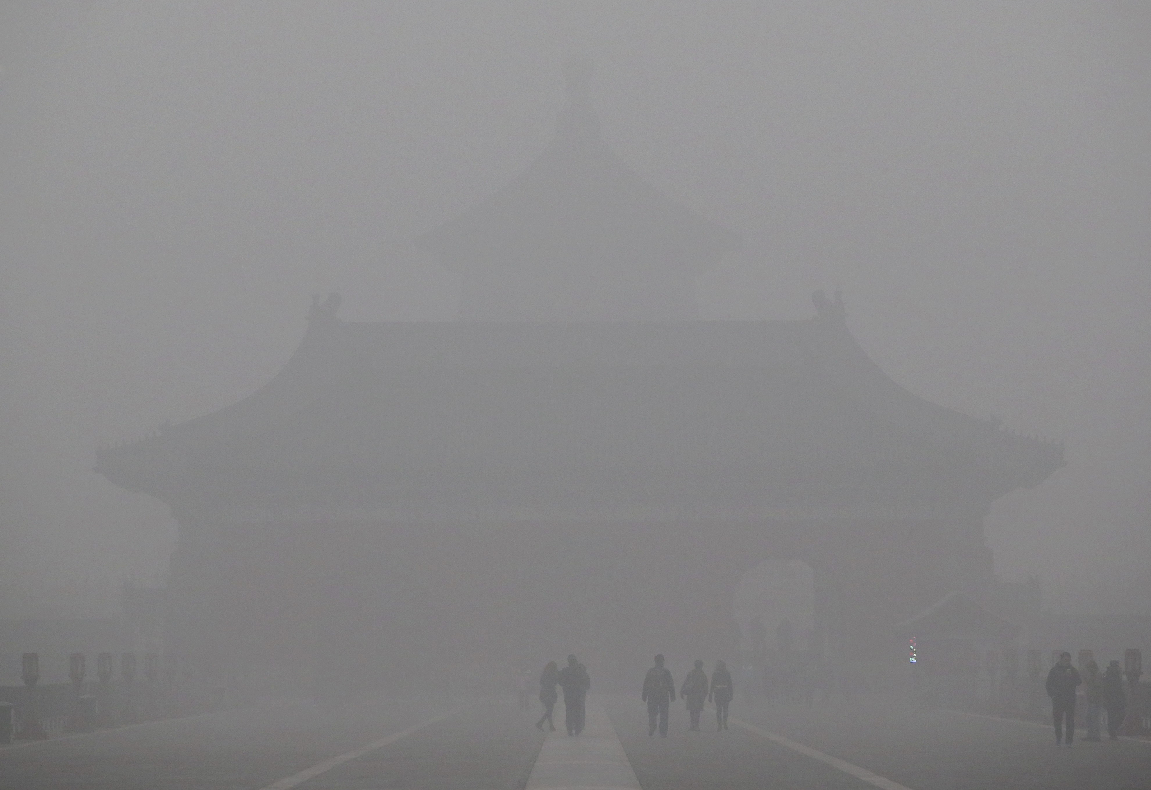 Beijing's Temple of Heaven is barely visible in thick smog.