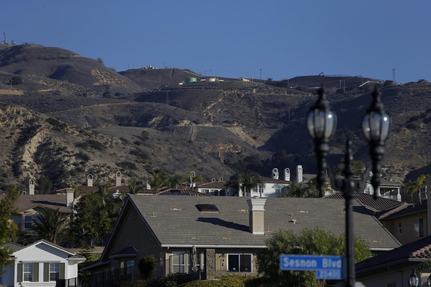 Heavy machinery and equipment sits along the hillside of the SoCalGas Aliso Canyon Storage Facility behind a Porter Ranch Housing development on Sesnon Boulevard on December 30, 2015. A week later, on January 6, California declared a state of emergency of the environmental disaster.