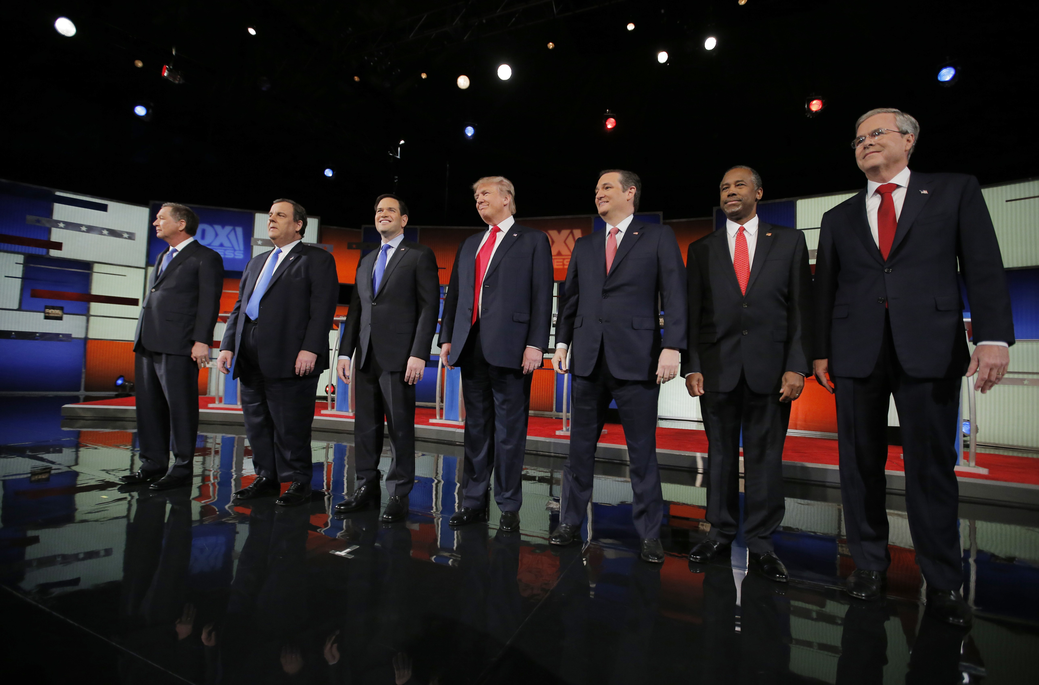 Republican U.S. presidential candidates pose together before the start of the Fox Business Network Republican presidential candidates debate in North Charleston