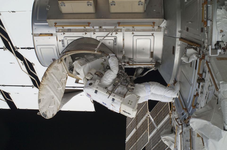 NASA astronaut Ron Garan egresses the International Space Station's Quest airlock at the beginning of the last spacewalk conducted while a space shuttle is docked to the station in this photo provided by NASA and taken July 12, 2011. 