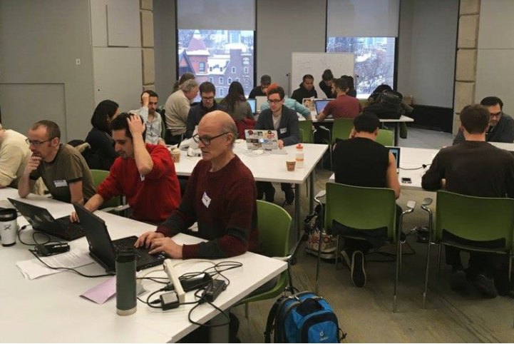 People work on identifying and archiving datasets with information about climate change at the Guerrilla Archiving Event in Toronto, Canada.