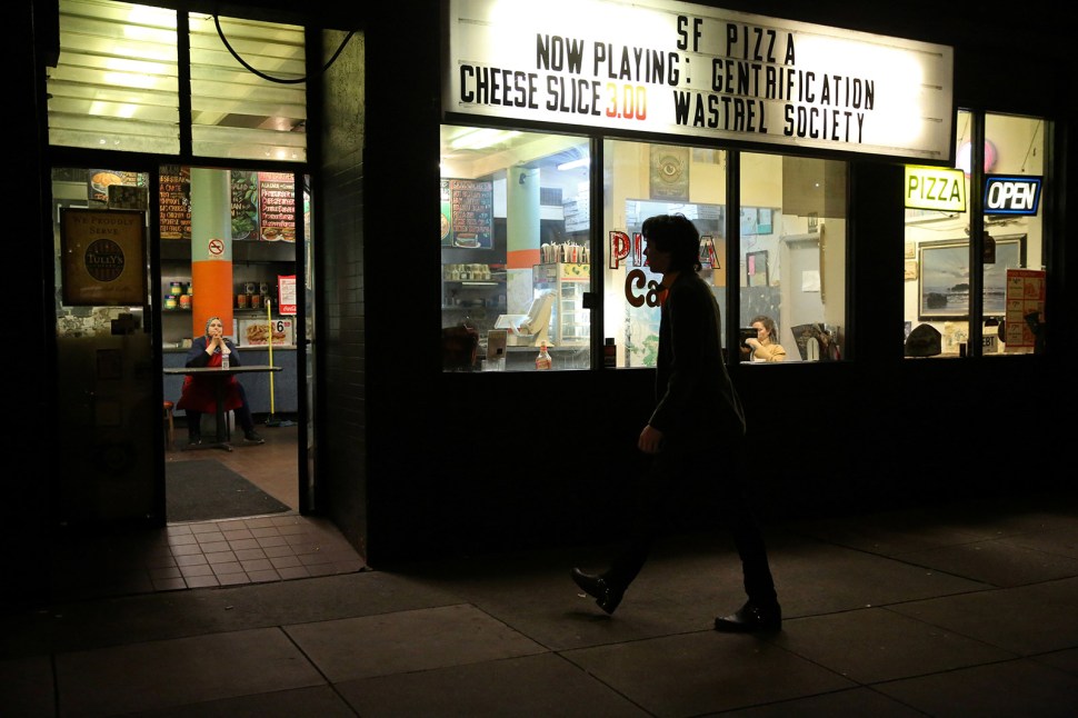 Zander Dejah, 25, a Virtual Reality engineer who lives at the Negev tech house, walks into SF Pizza to get some food on the way home from a bar in San Francisco.