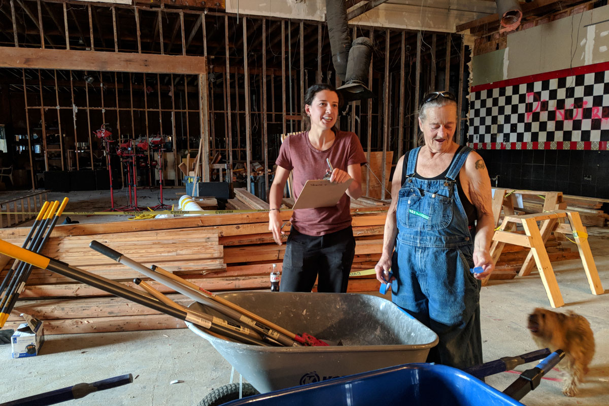 Brenna Bailey and Linda Dentler volunteer to inventory Living Cully's mobile home weatherization program supplies.