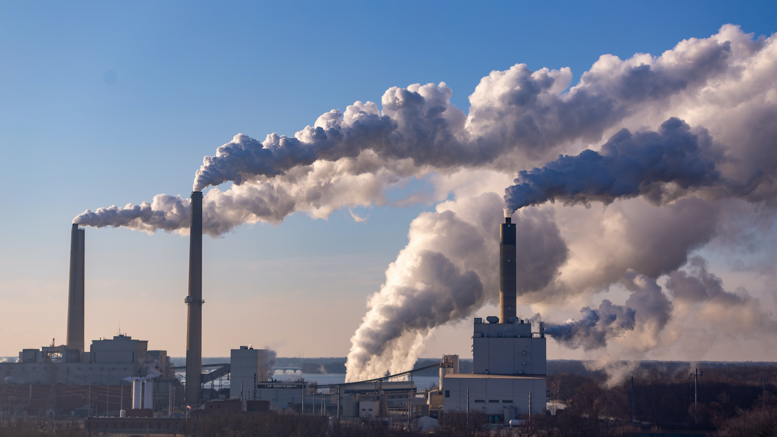 Wind blowing pollution from a coal burning power plant