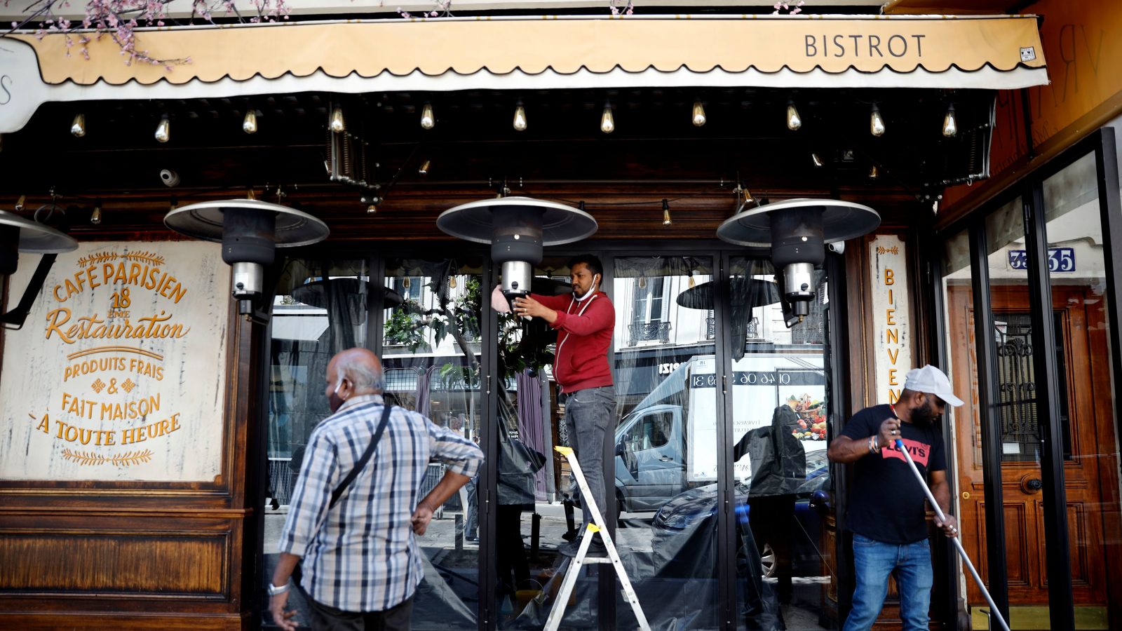 Turning off outdoor heaters at the French bistrot.