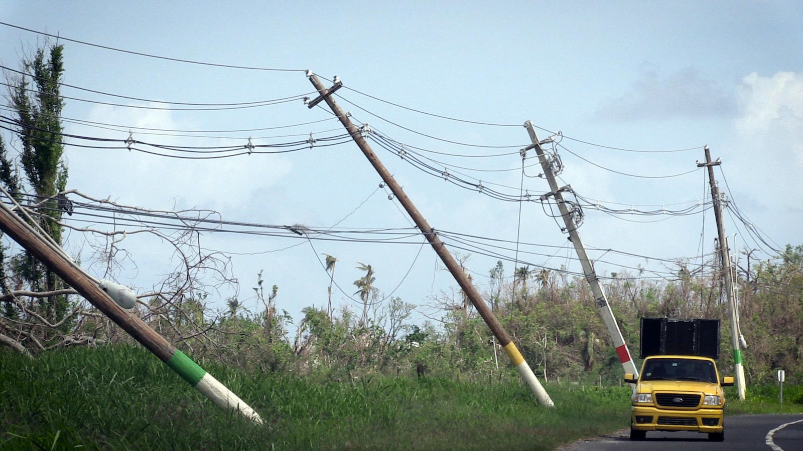 In powerless Puerto Rico, washboards and hand-held fans make a comeback