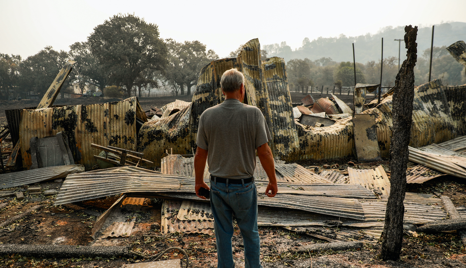 A man surveys the damage done