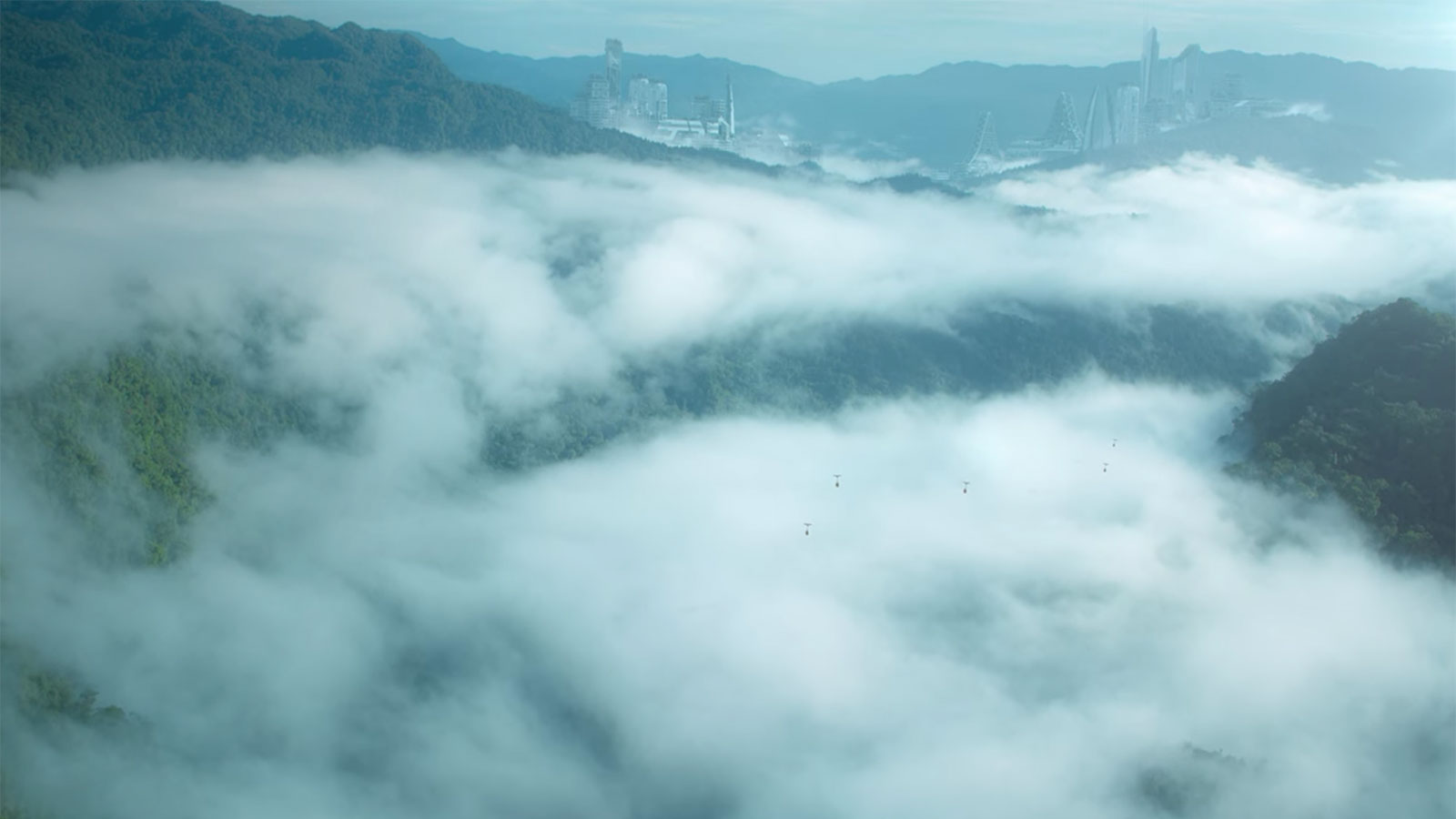 In a screencap from 'A Life on Our Planet', a shining city peeps out over a curtain of mist.