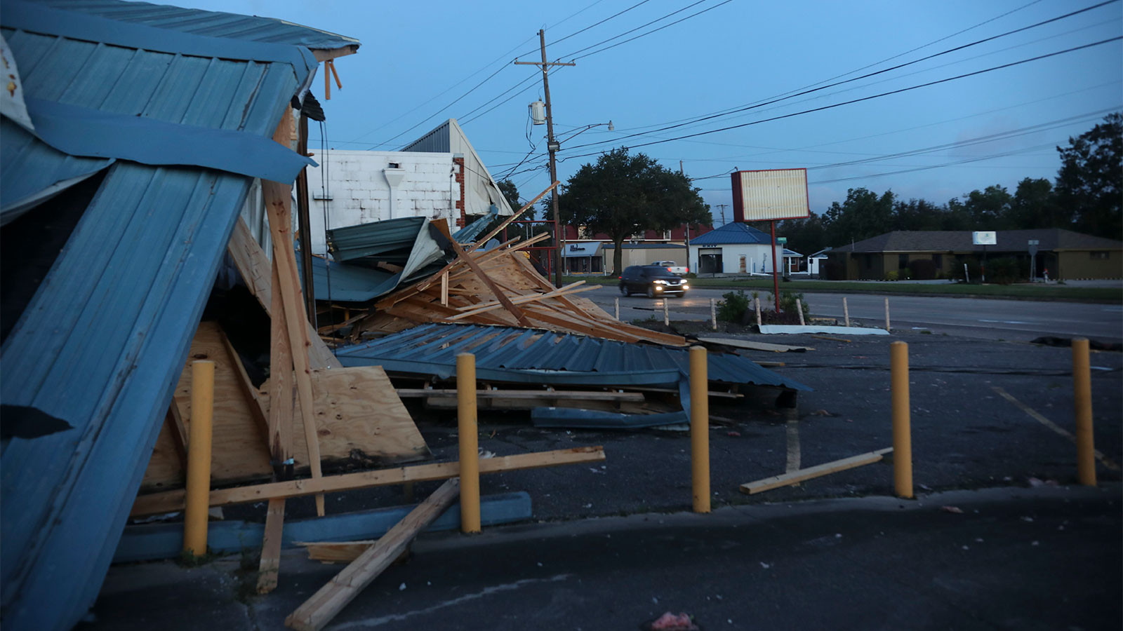 Workers clear debris from Hurricane Zeta at St Bernard Middle School on October 29, 2020 in St Bernard, Louisiana.