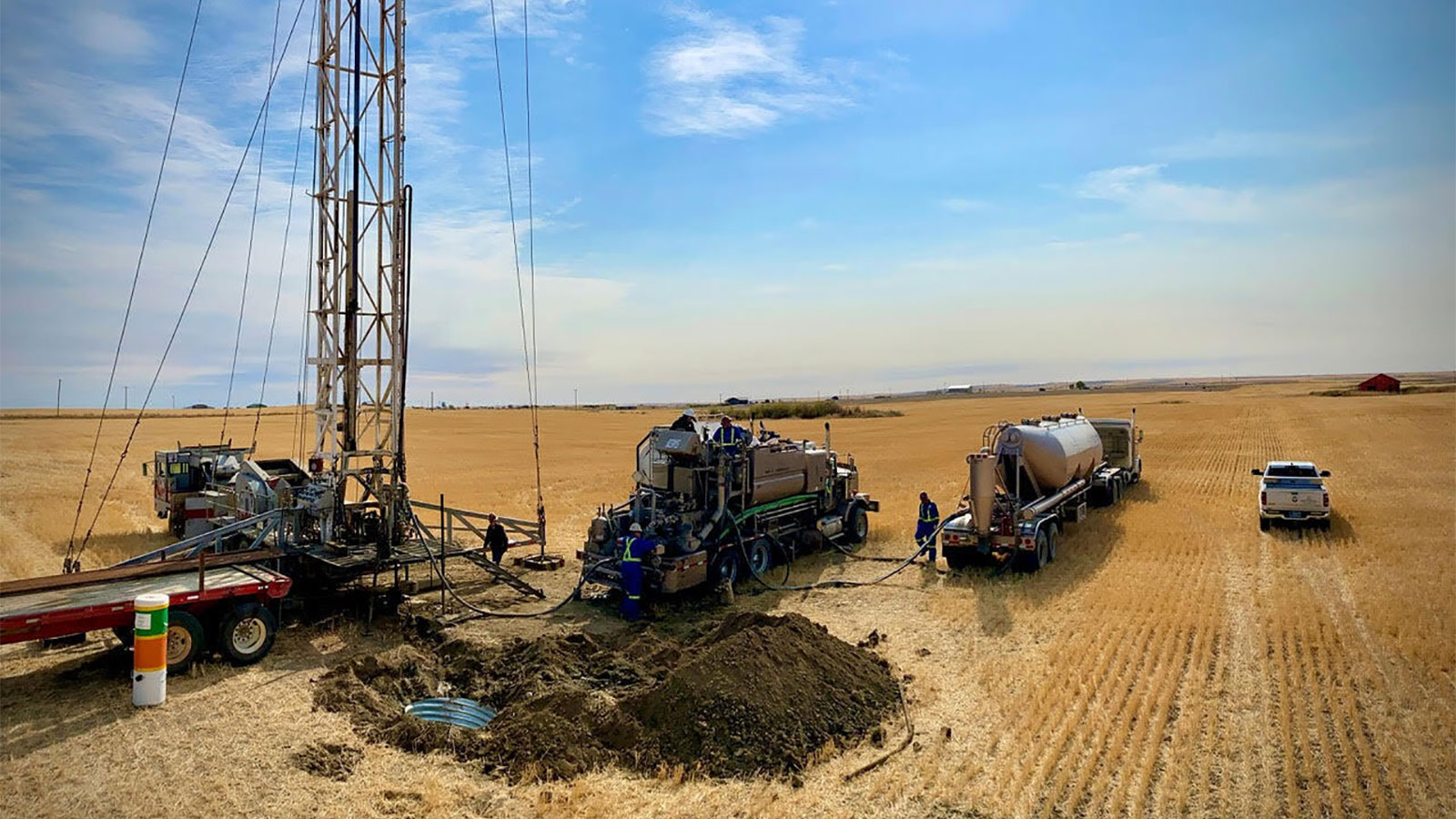 photo of volunteers with trucks plugging abandoned oil well