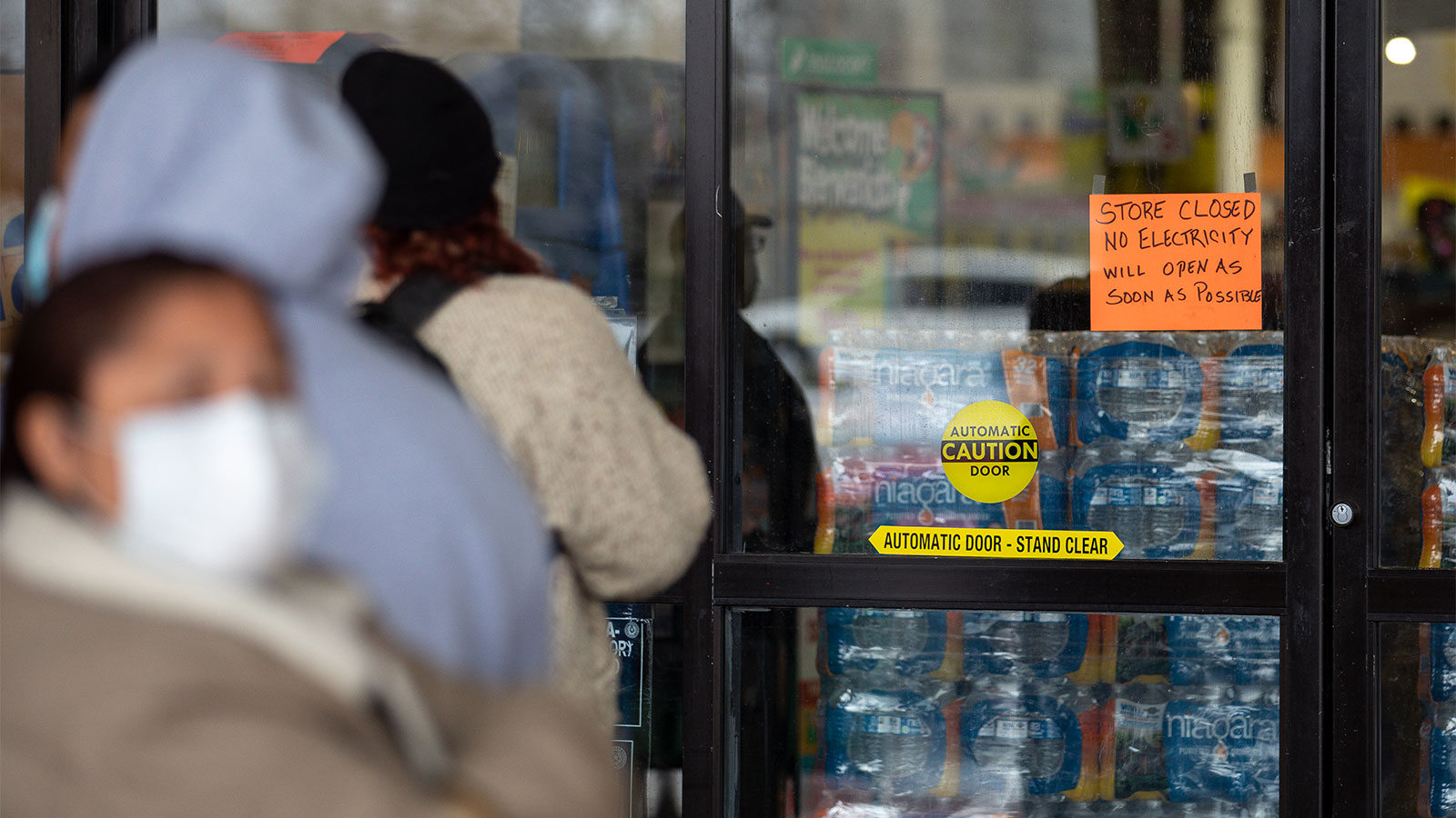 A photograph of people waiting in line for Fiesta Mart to open after the store lost electricity in Austin, Texas on February 17, 2021