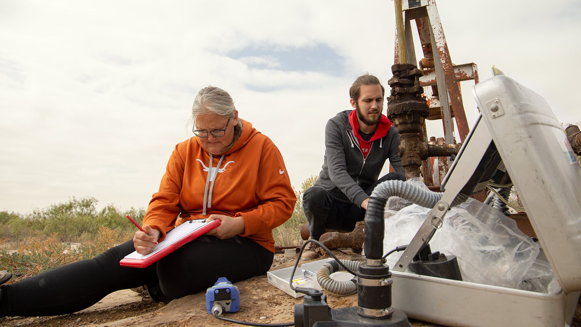 Amy Townsend-Small and assistant measuring methane from well