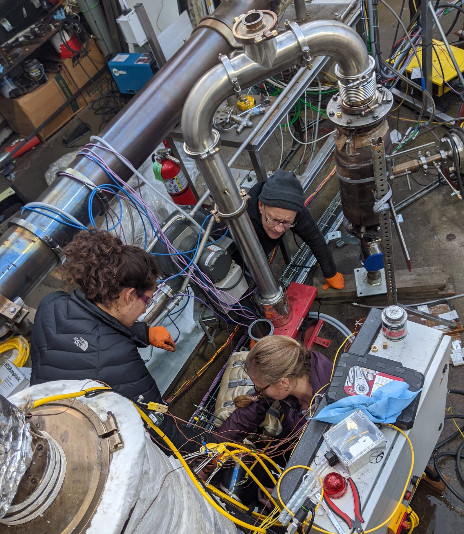 Charm industrial team members work on the pyrolyzer