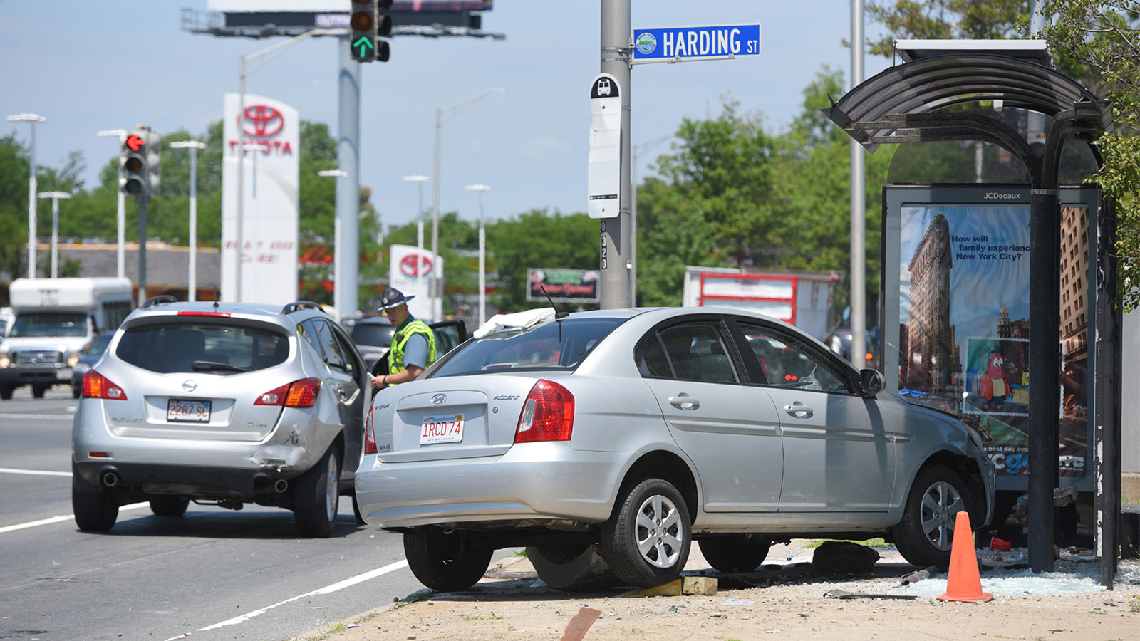 A car that has crashed into a bus stop