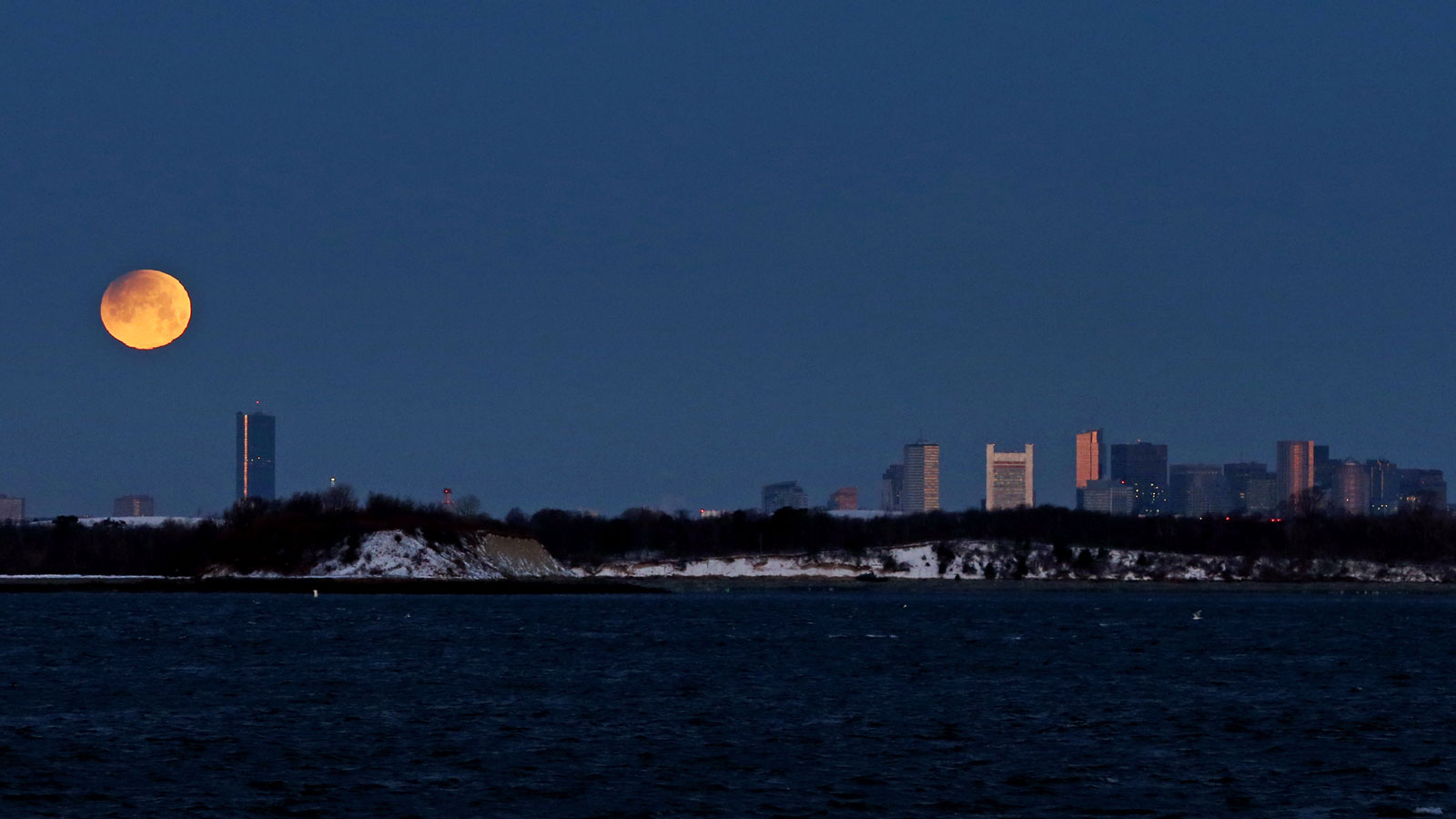 A super blue blood moon setting over Boston