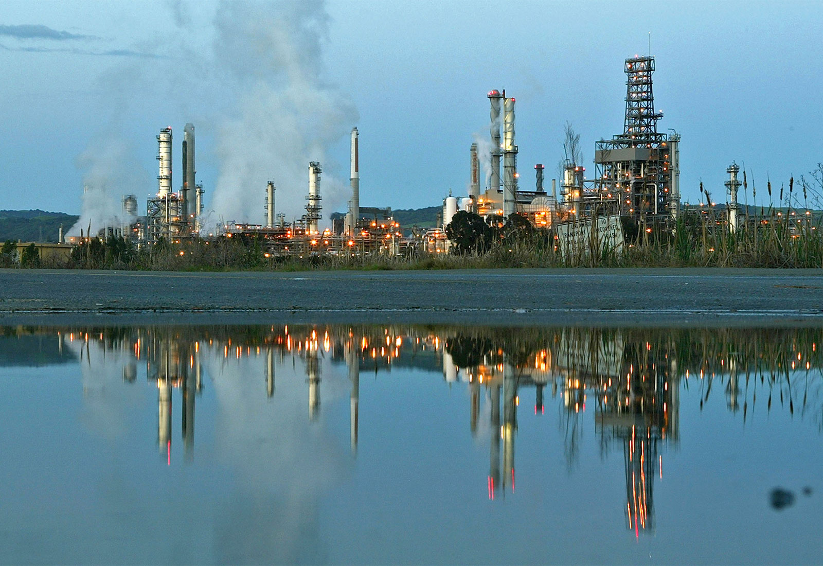 Smoke drifting away from a Shell Oil refinery