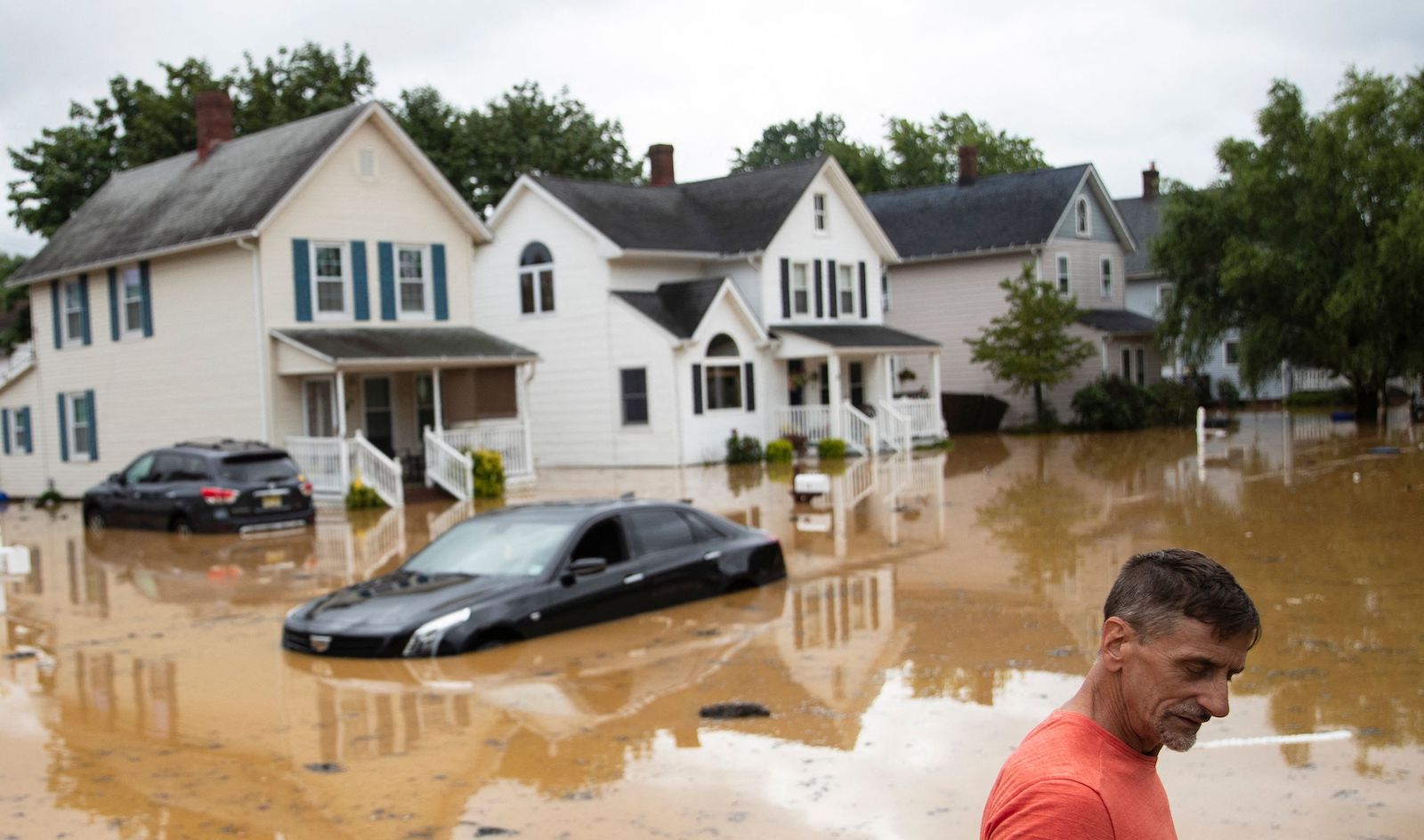 A car is submerged in water due to Tropical Storm Henri