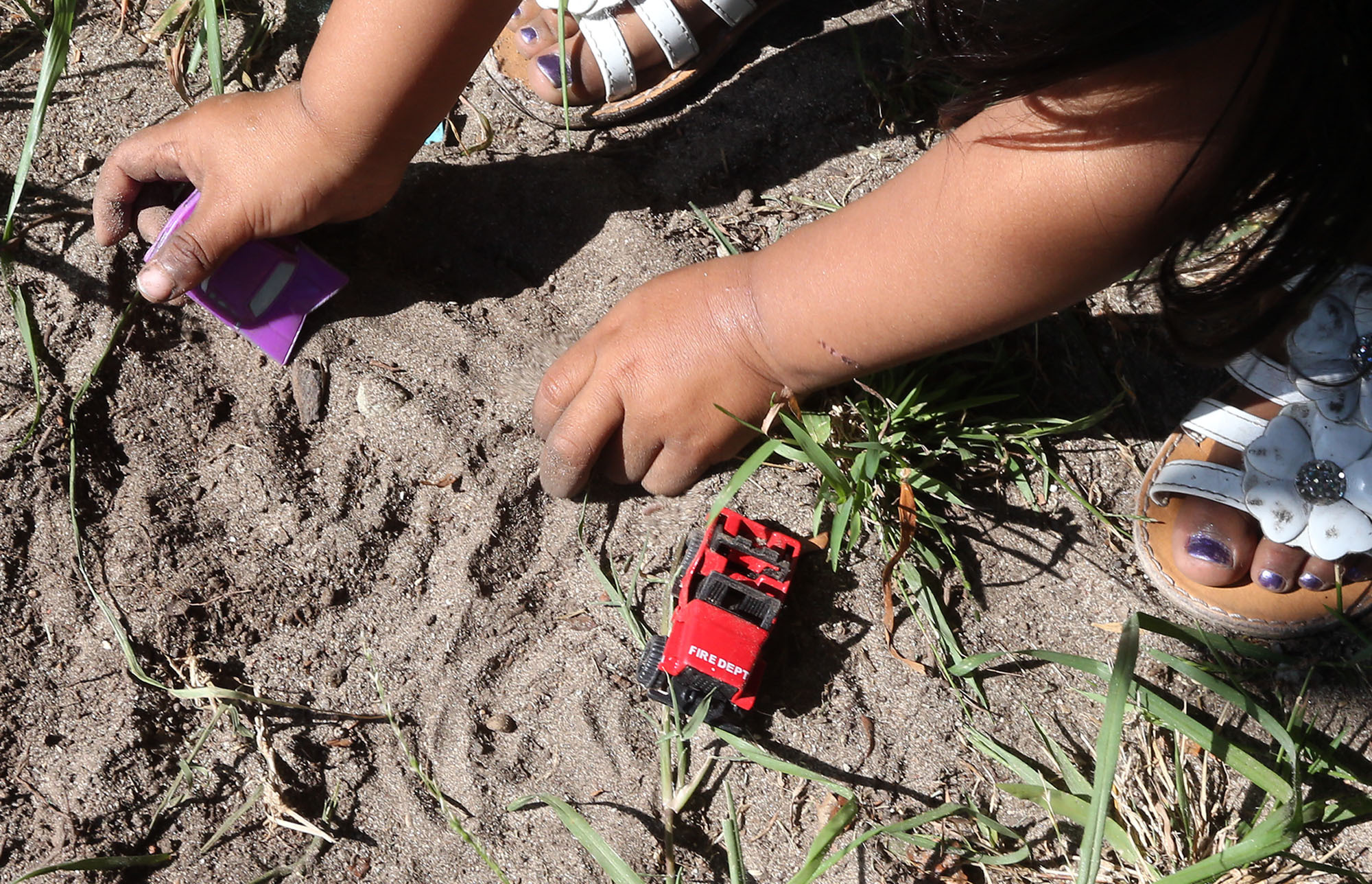 young kid playing in dirt in Santa Ana