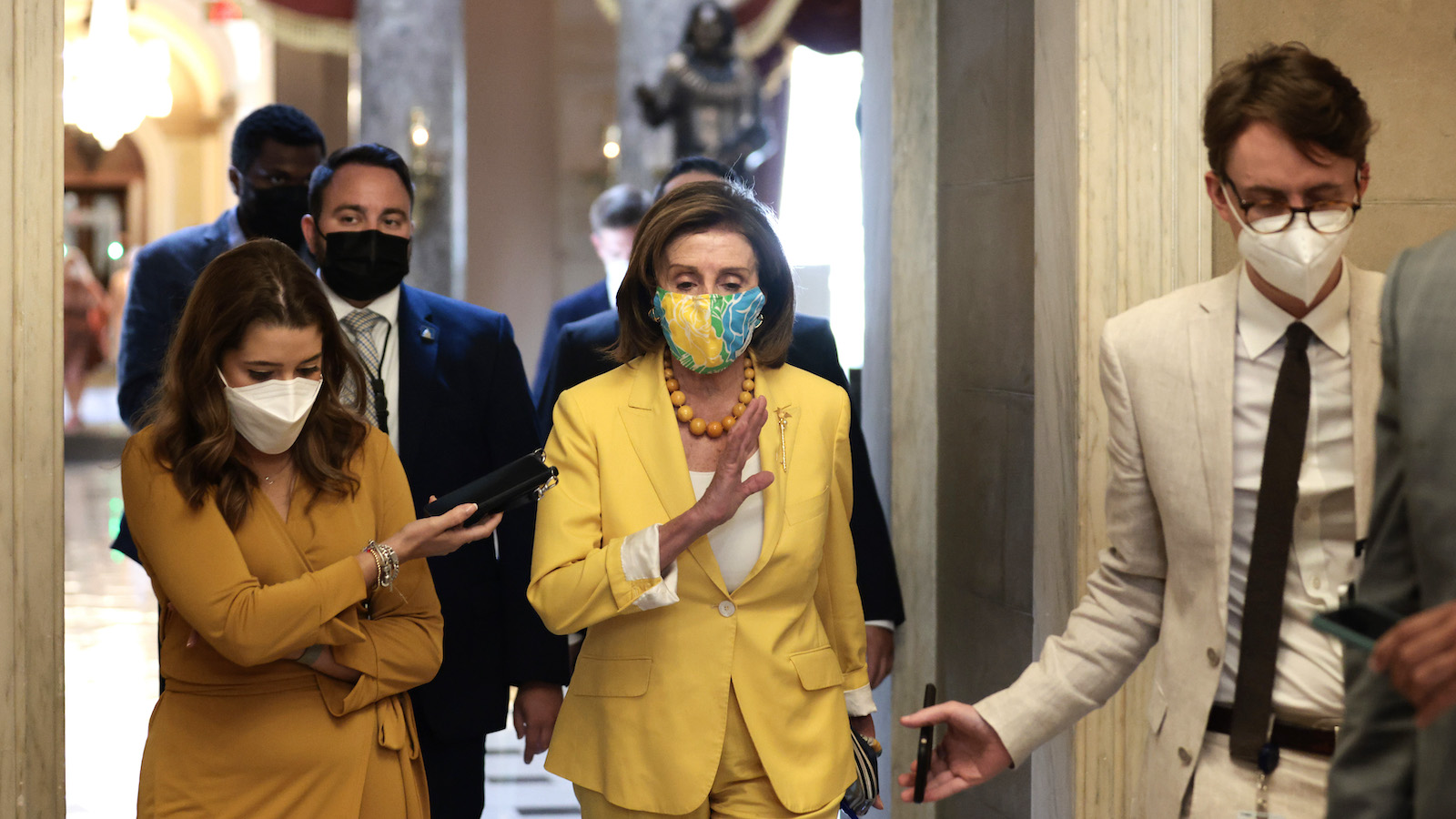 Nancy Pelosi speaks to a reporter