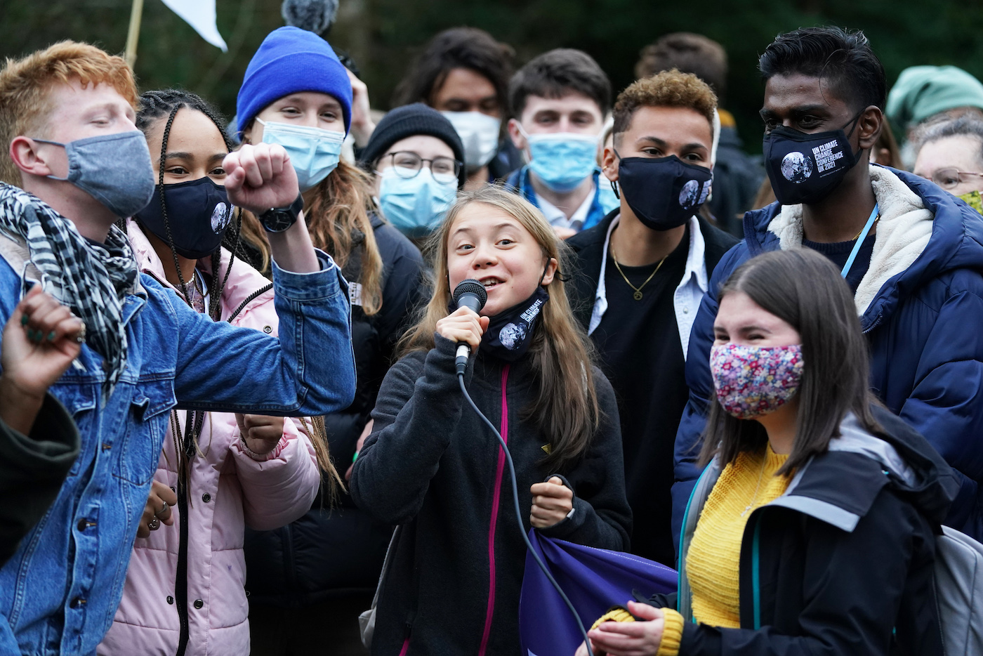 Greta Thunberg gives a speech among a crowd in Glasgow