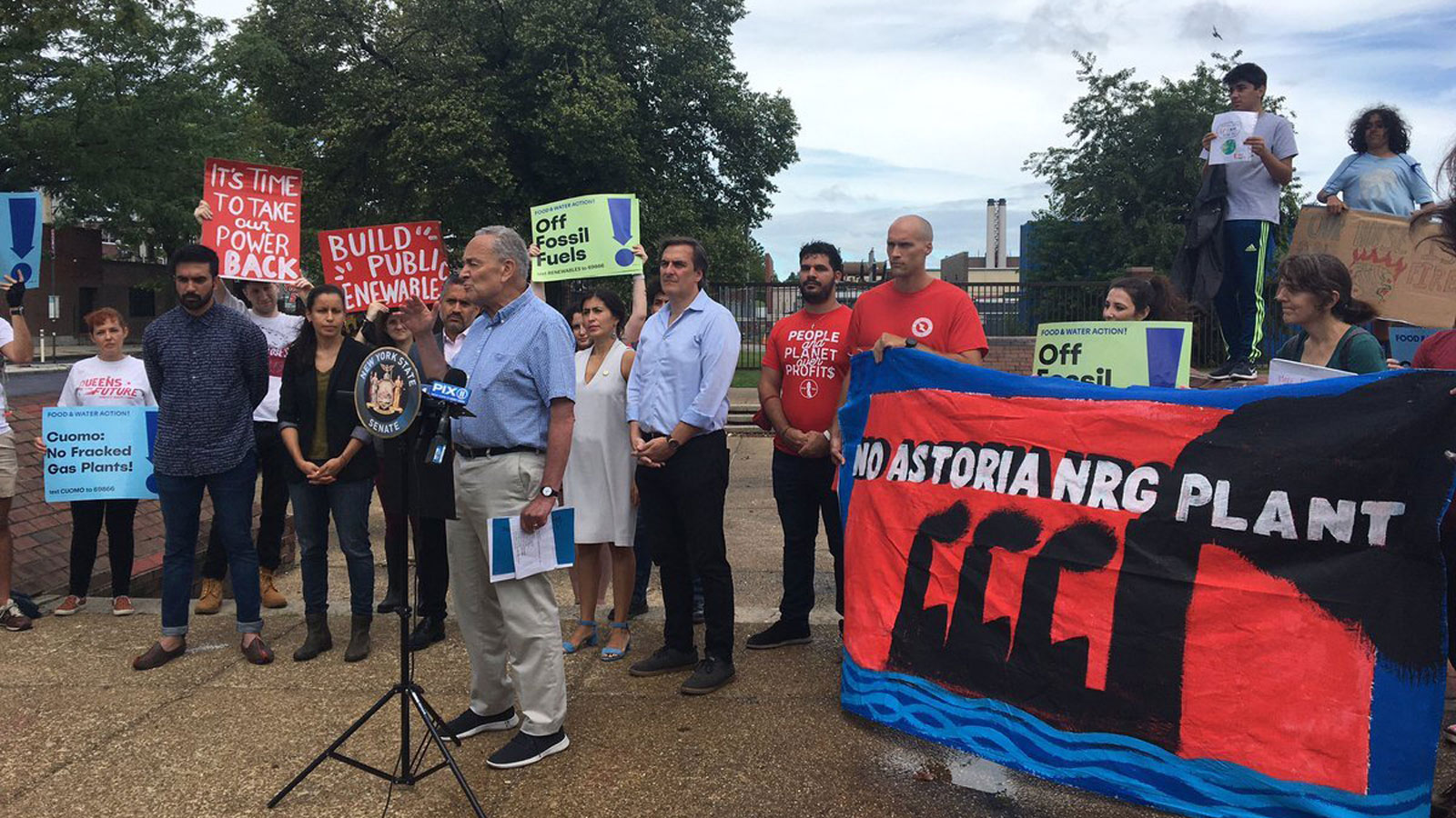 Chuck Schumer speaks at a rally against a power plant in Queens