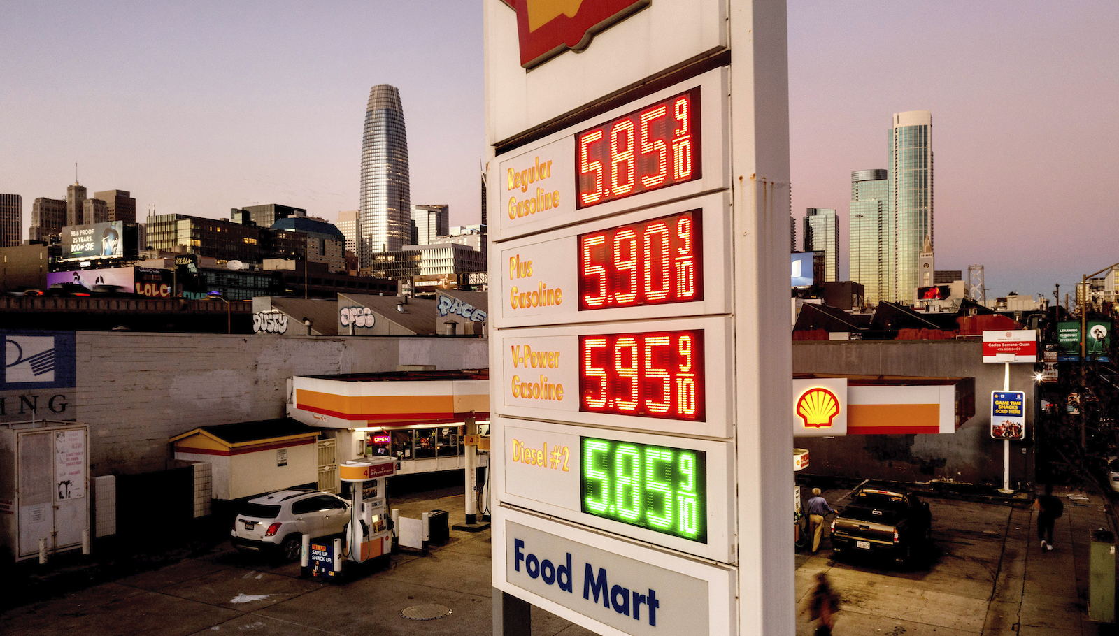 a sign at a Shell gas station lists gas prices as high as $5.85