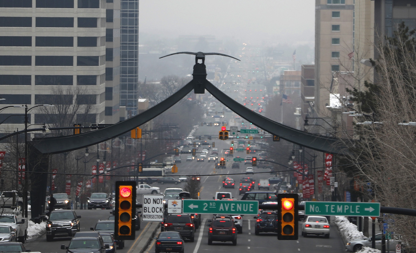 cars on a busy street in Salt Lake City with visible smog