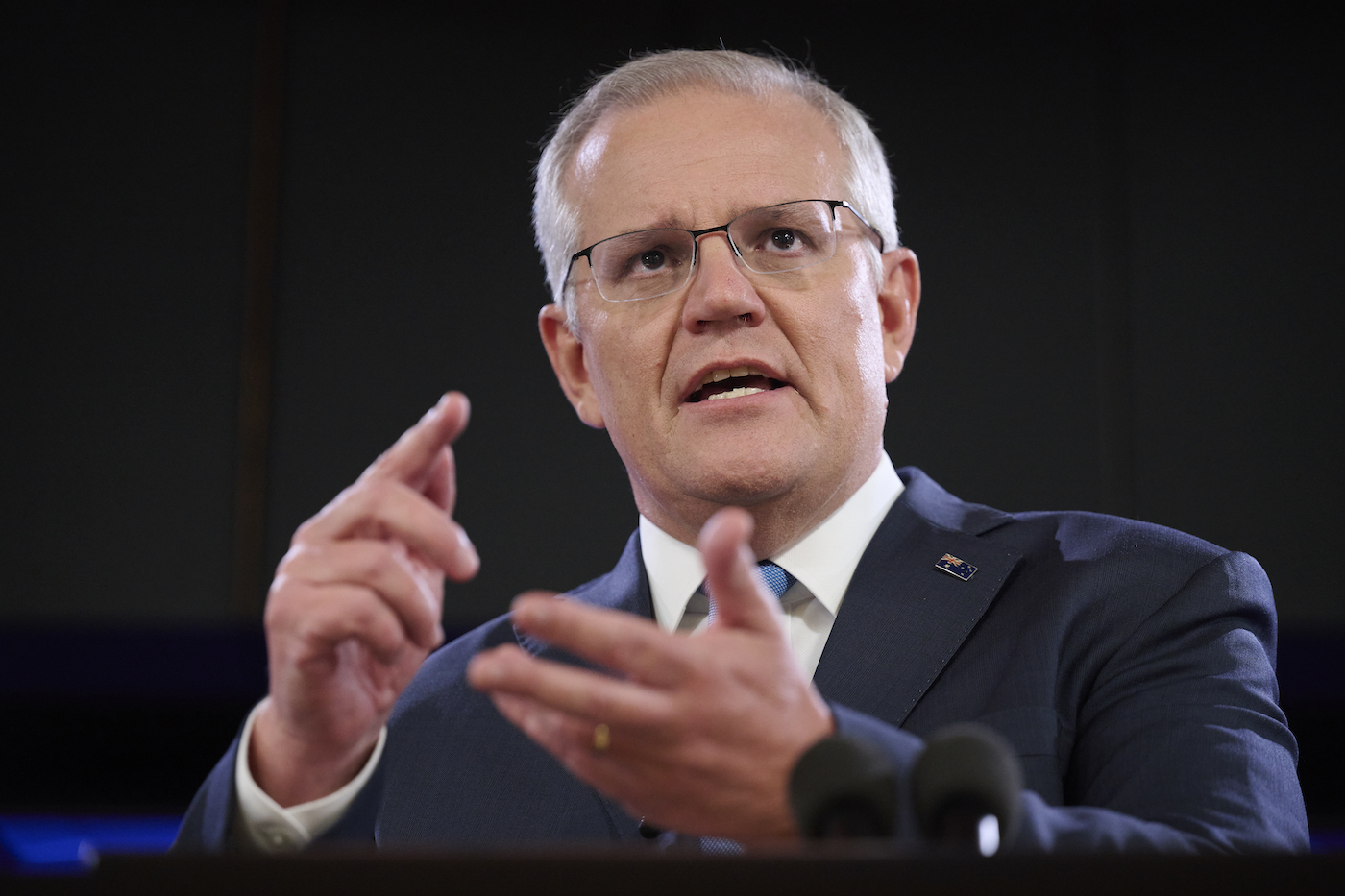 Photo: Australian Prime Minister Scott Morrison arrives to anti-vaccine protestors at the National Press Club.