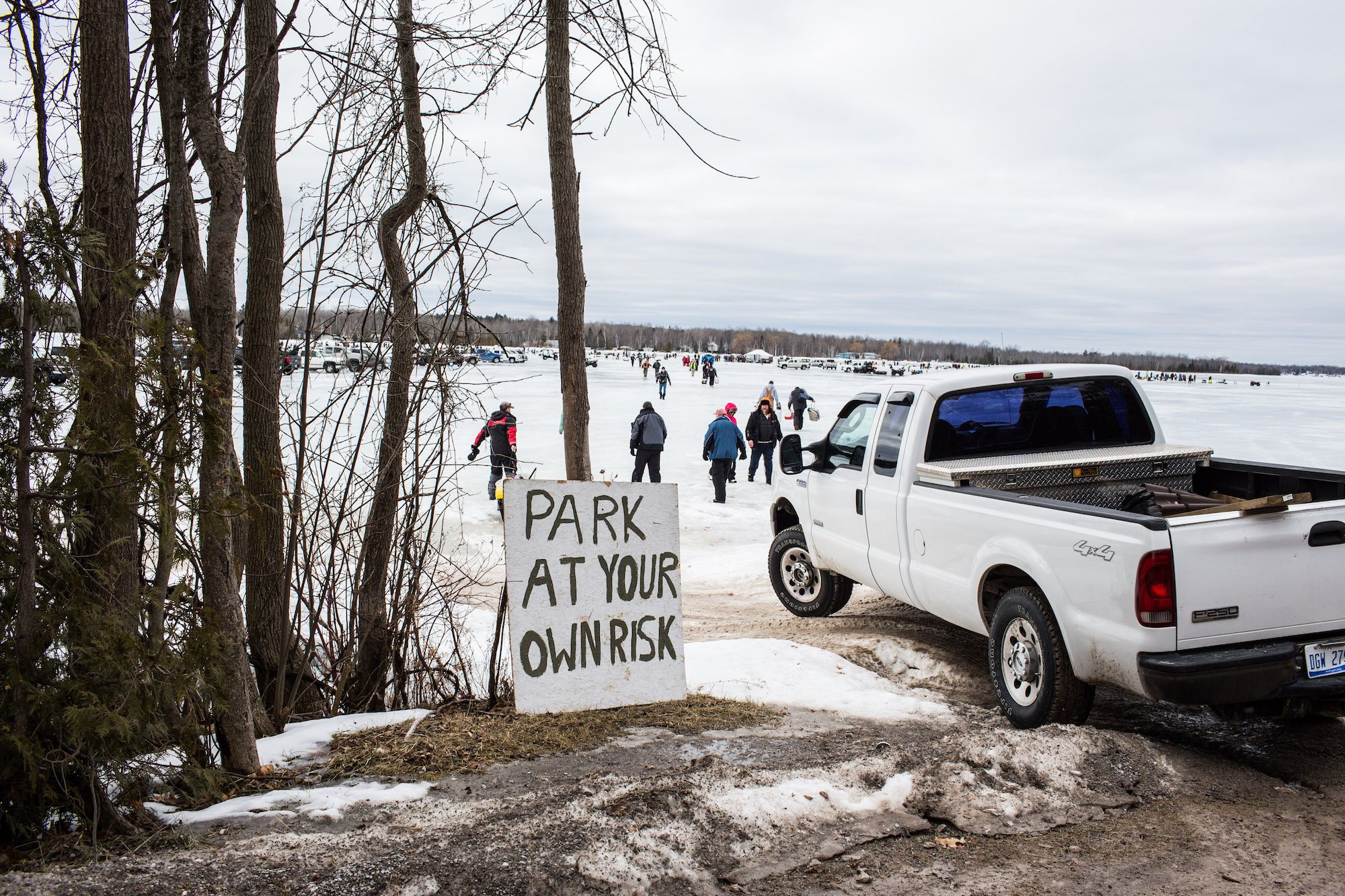 a truck parks near hte ice saying park at your own risk