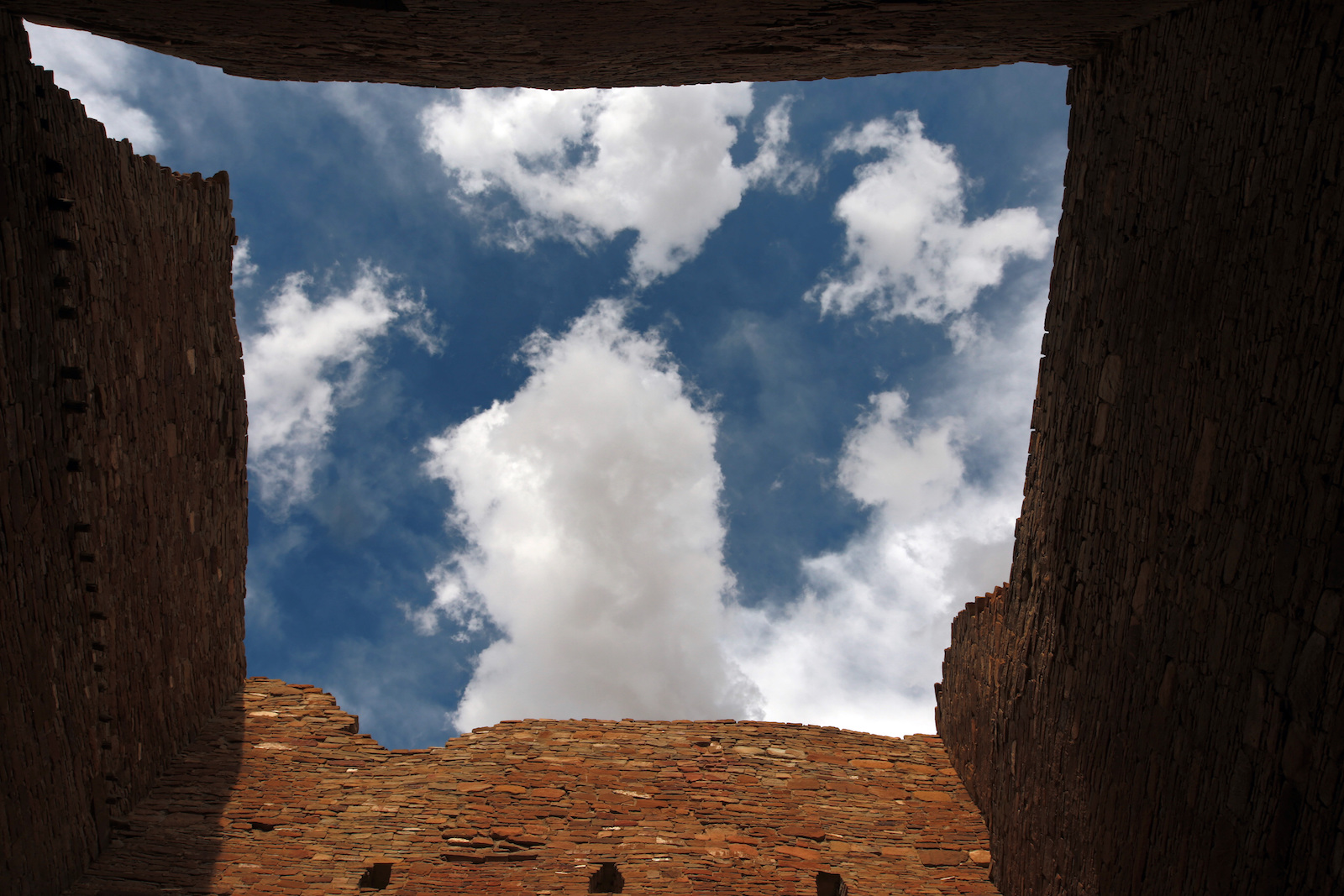 The sky as seen from a room believed to serve as as a storeroom for merchants or other residents of the pre-Colombian settlement on Wednesday, Oct. 6, 2021, at Chaco Culture National Historical Park, New Mexico. Top officials with the largest Native American tribe in the United States are renewing a request for congressional leaders to hold a field hearing before deciding on federal legislation aimed at limiting oil and gas development around Chaco Culture National Historical Park.