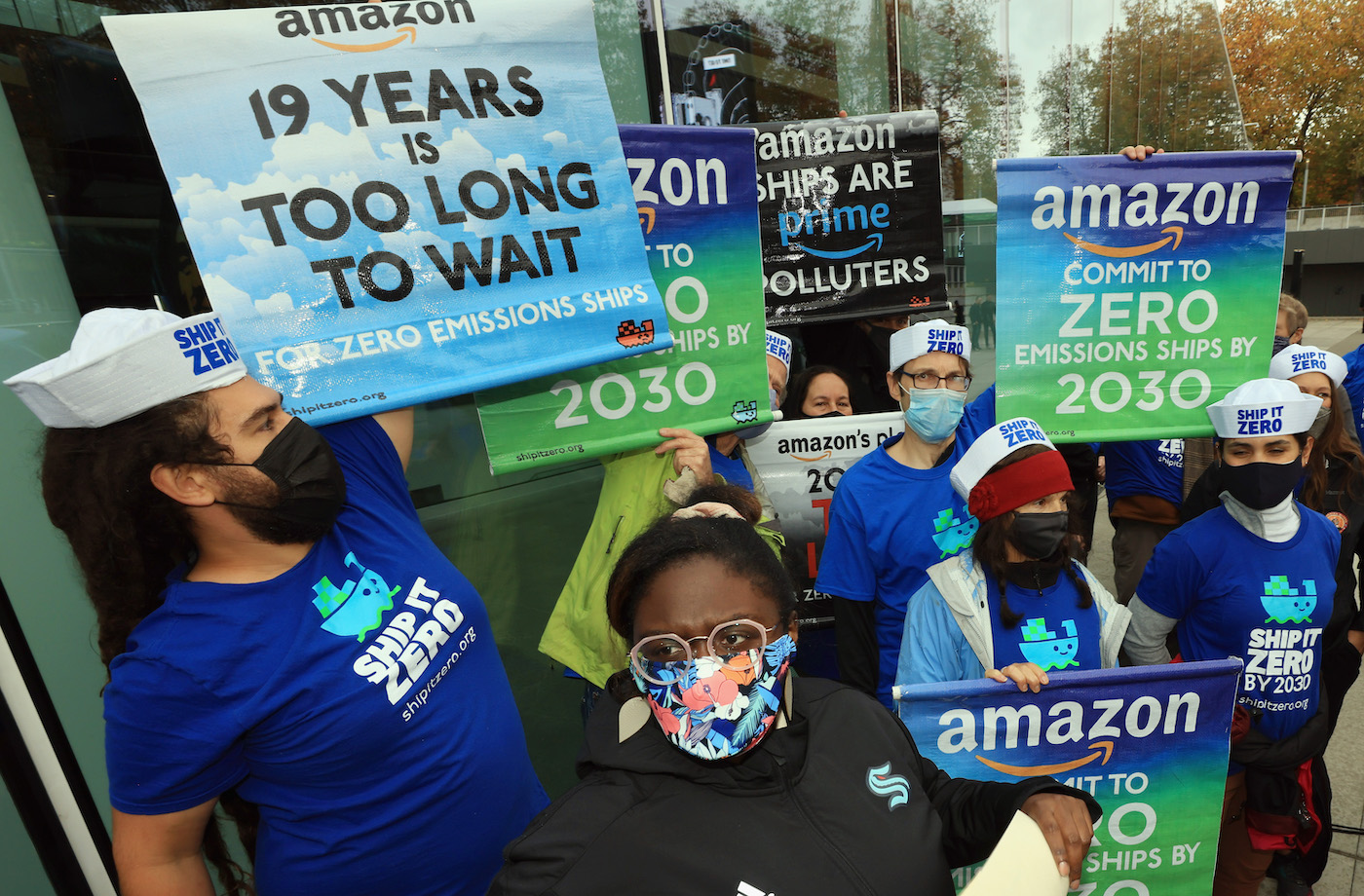 Protestors line up as Andy Jassy, the CEO of Amazon, speaks at the ceremonial ribbon cutting prior to tomorrow's opening night for the NHL's newest hockey franchise at the Climate Pledge Arena on October 22, 2021 in Seattle, Washington.