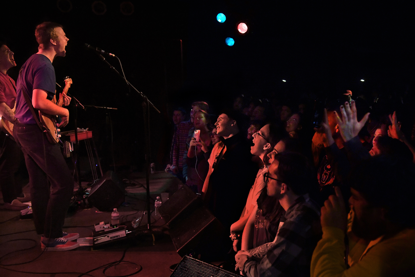 Pinegrove band performs on stage and audience sings along