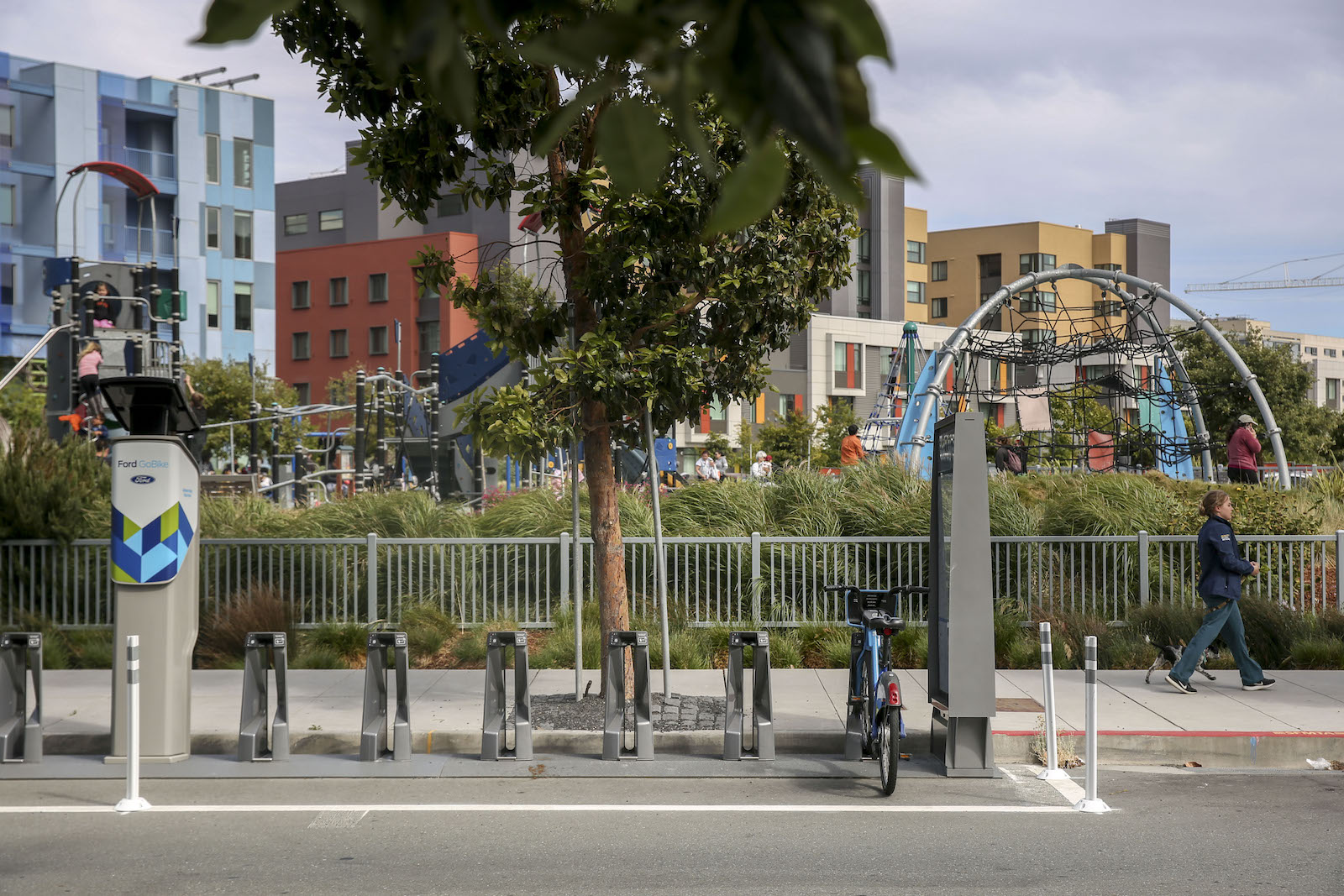 bike stand near buildings and park