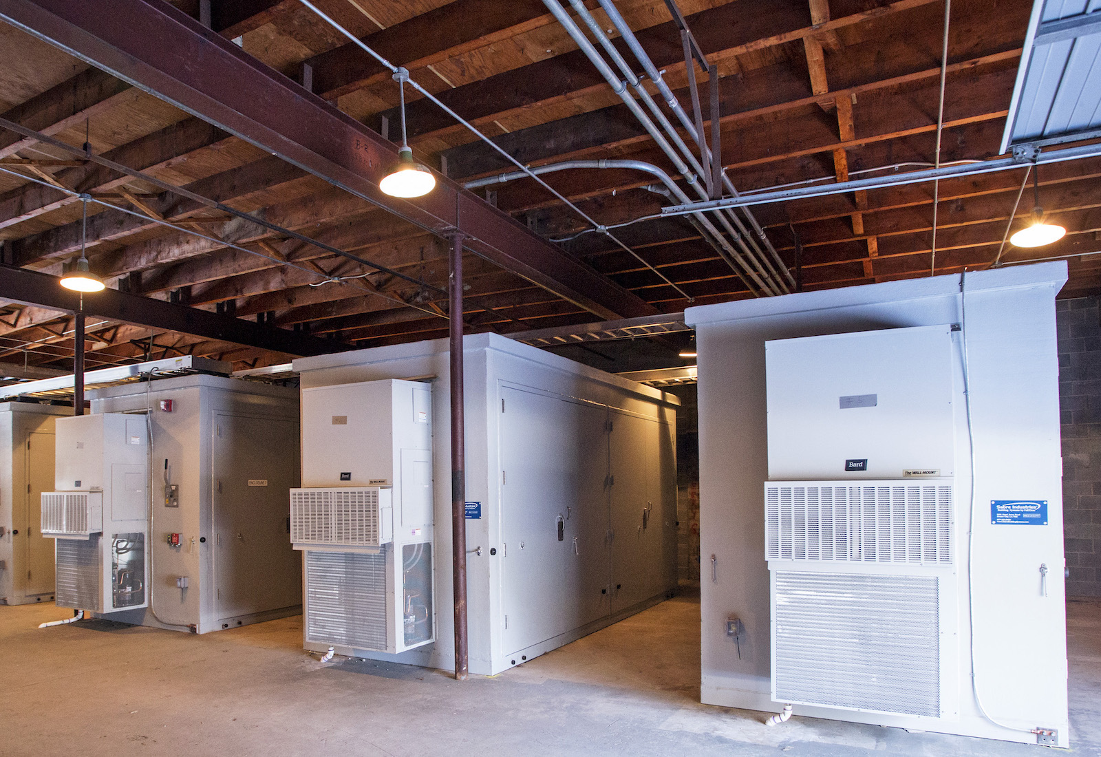 large, rectangular, white batteries in a warehouse