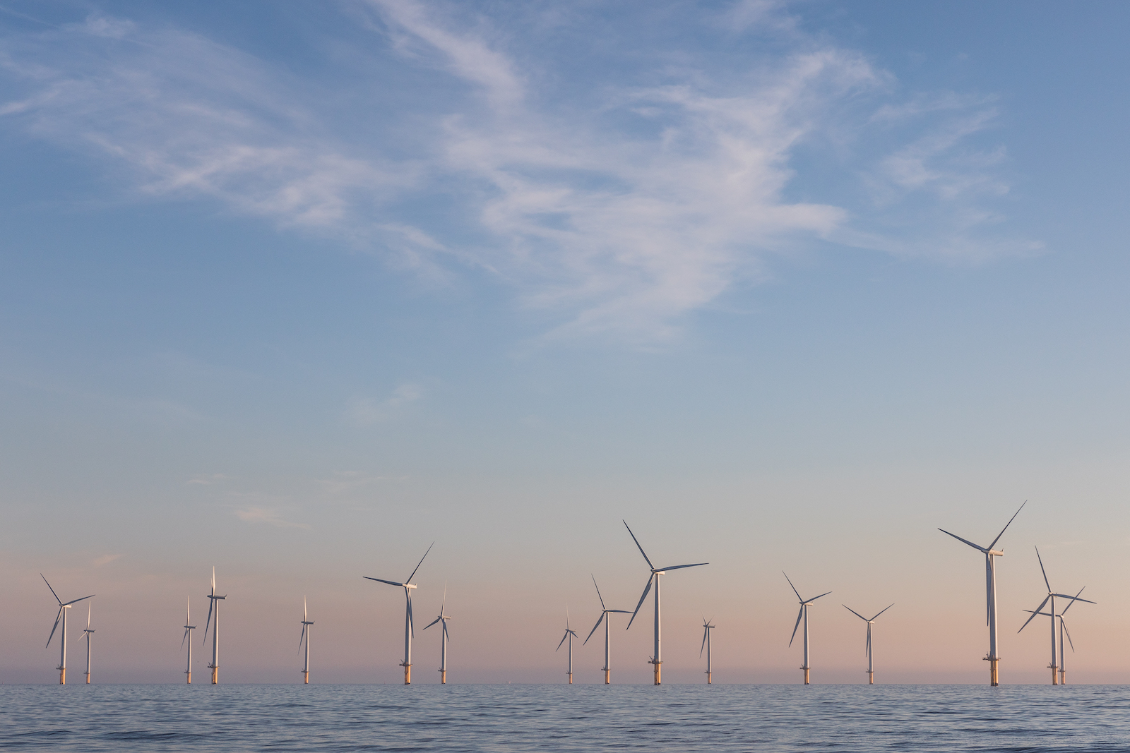 offshore wind turbines at sunset