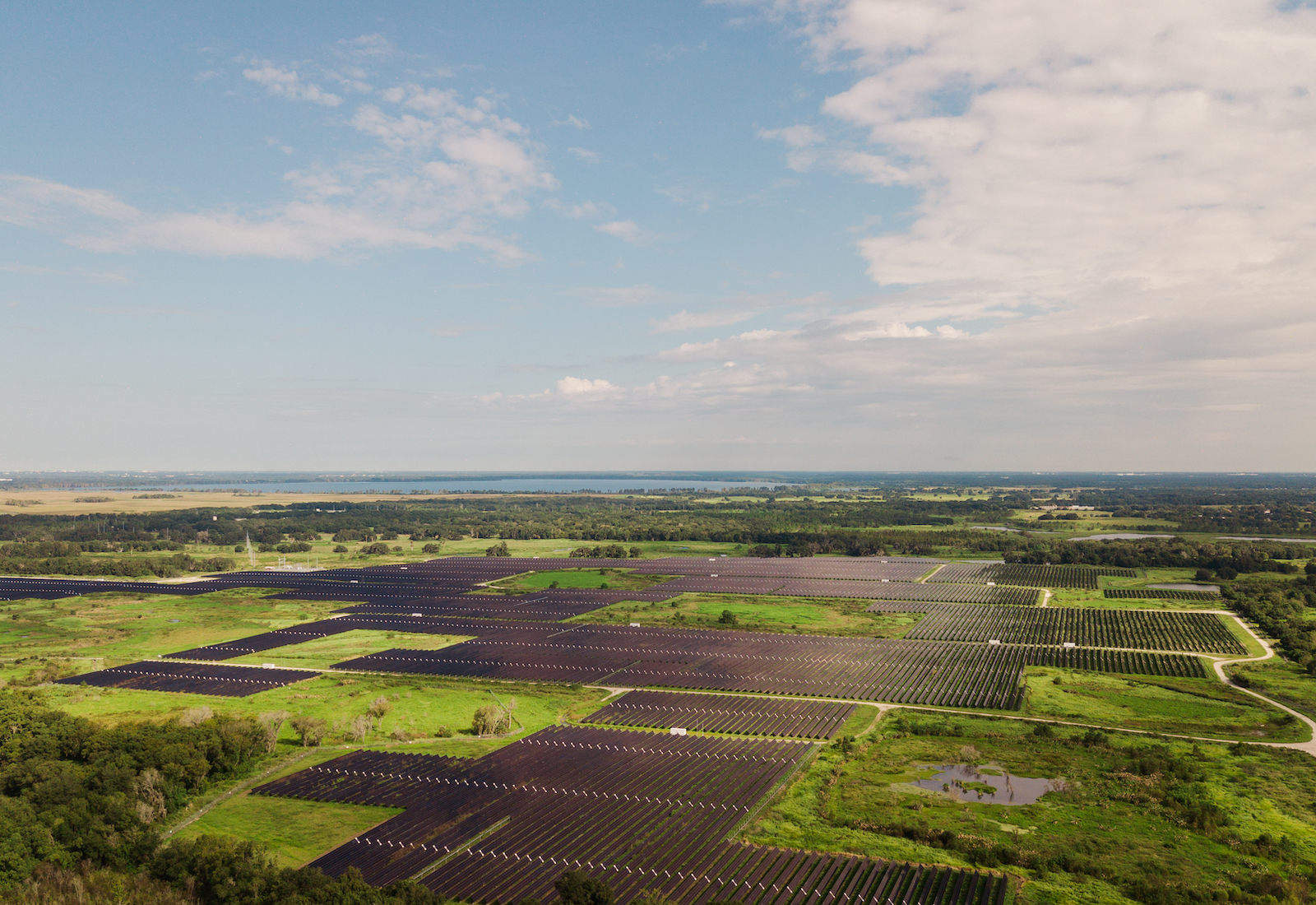 Solar panels on a field with blue sky