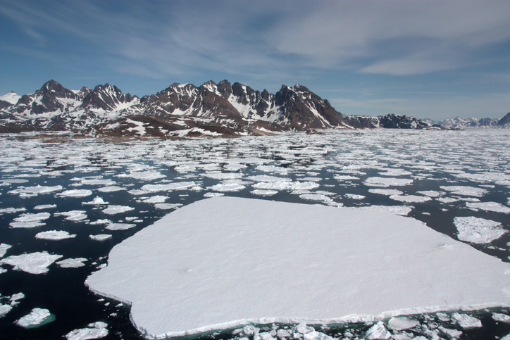 ice breaking into small pieces and scattering across the ocean