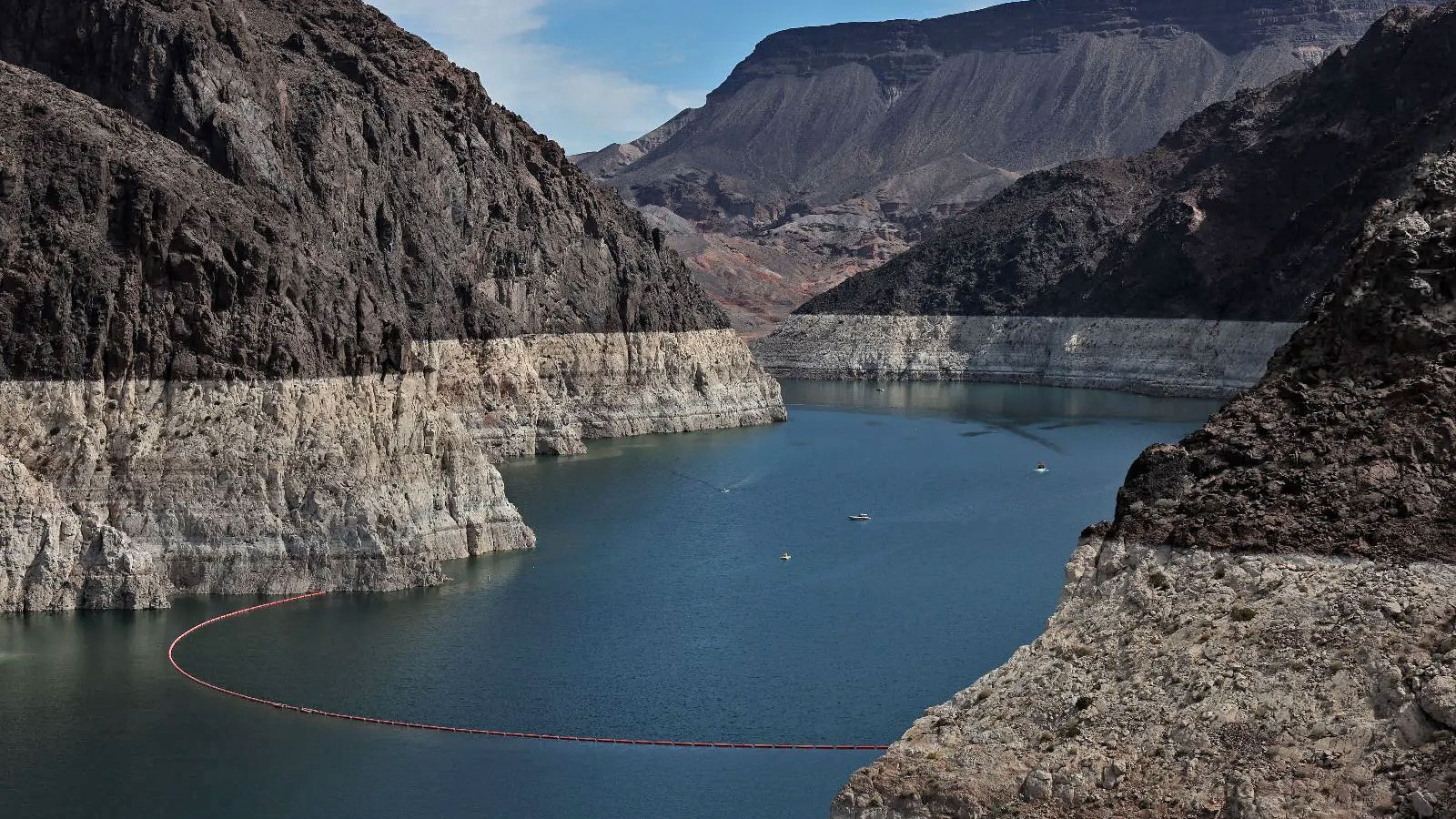 Lake Mead, surrounded by rock formations with bleached 