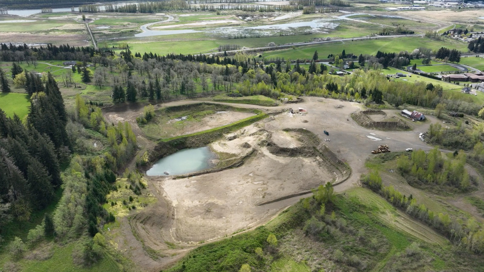 Aerial view of land that has been carved out for a mine