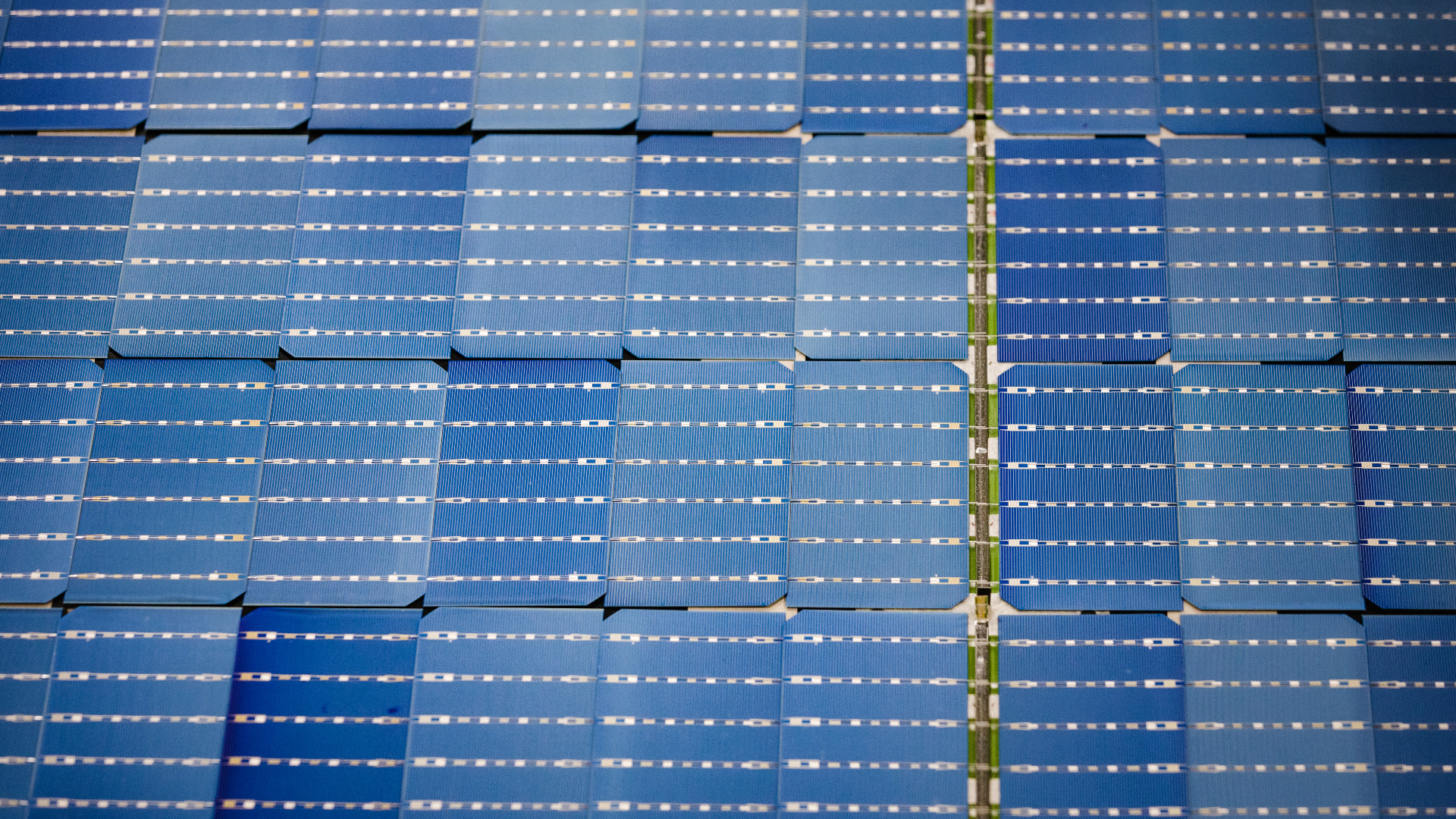 Arrays of solar cells on conveyor belt at Qcells, a solar panel manufacturer in Dalton, Georgia. China's dominance over solar manufacturing leaves America in a vulnerable place. Now, U.S. firms are racing to revive this idled industry at home. At the center of this movement is a plant in Dalton, Georgia where solar panels are made. It is one of the only places in the US where this is happening. Is this plant an example of what is coming in the US or a vestige of a bygone manufacturing era? The stakes are high. If the U.S. can't figure out how to bring some of this supply chain back home, it could find itself boxed out of the market for the solar panels and cells desperately needed for the energy transition.