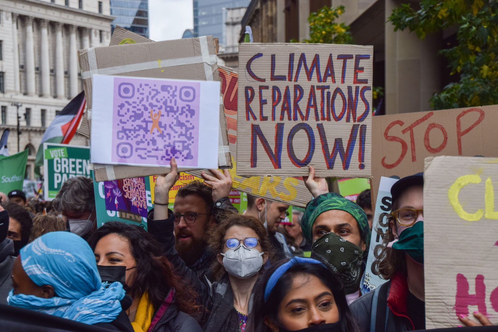 a group of people holding signs during a protest