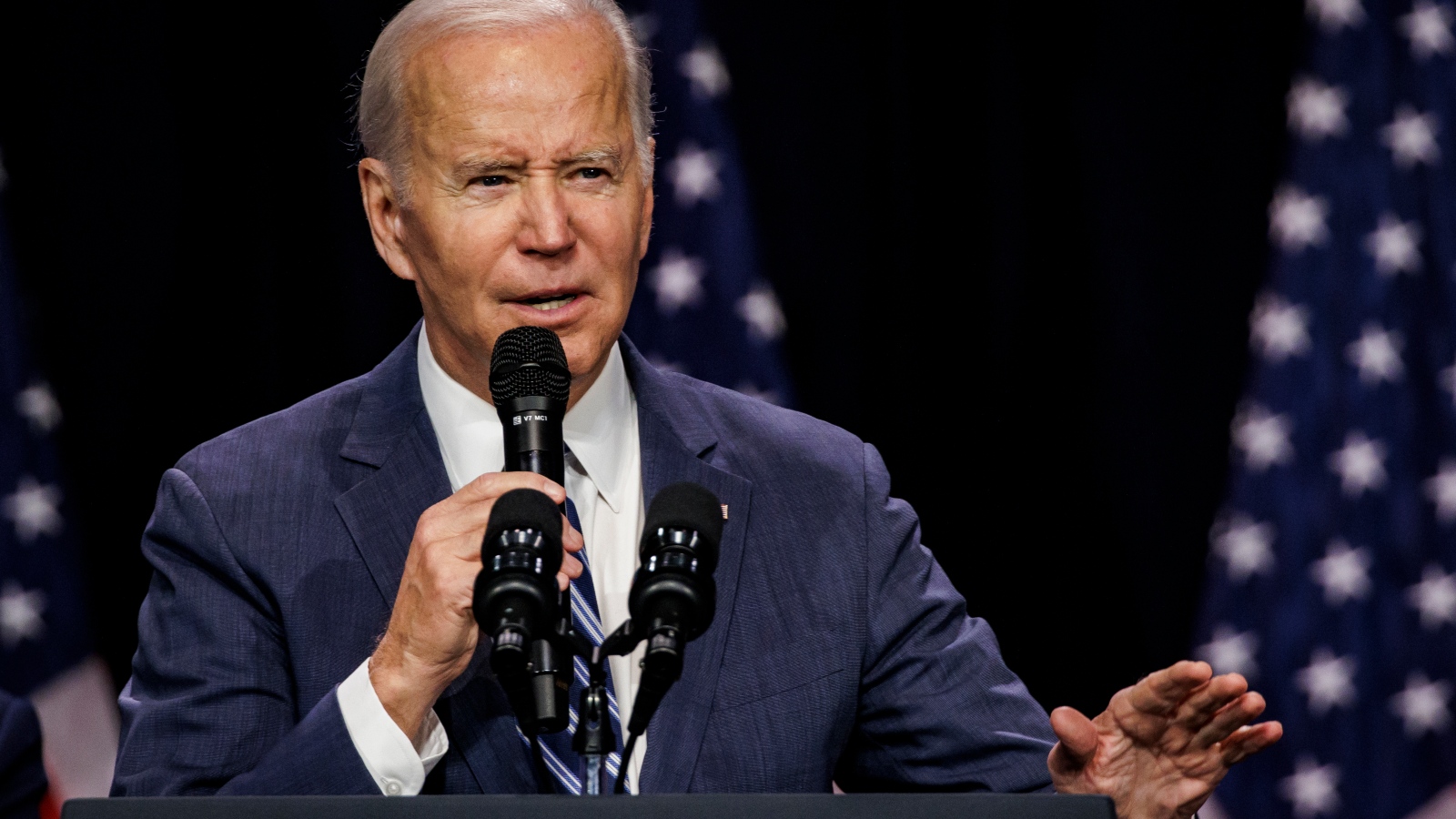 Joe Biden speaks into a microphone