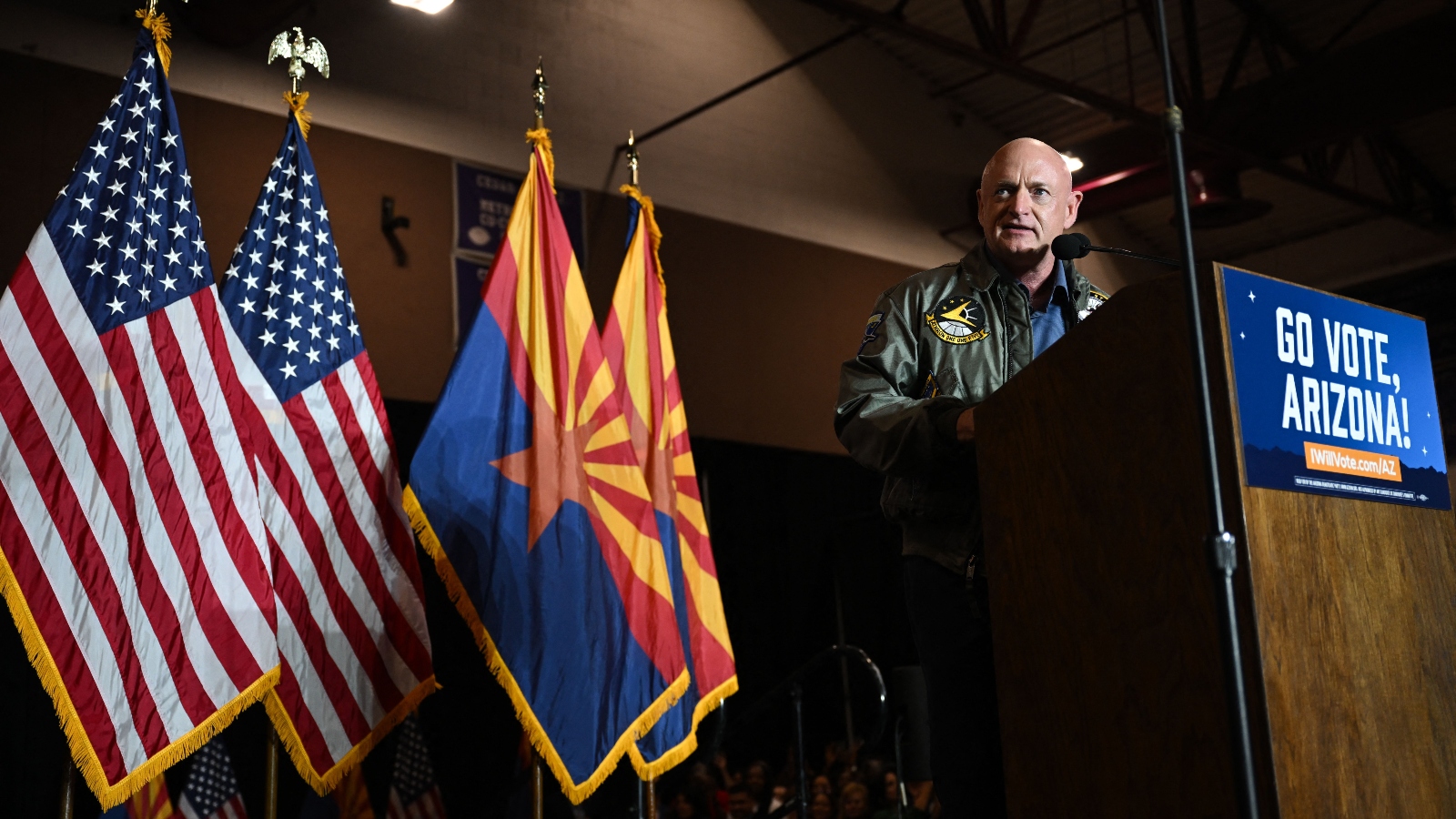 U.S. Senator Mark Kelly speaks during a campaign event with former President Barack Obama in Phoenix, Arizona.