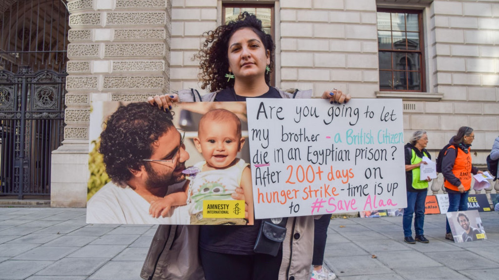 Sanaa Seif holds a picture of her brother.