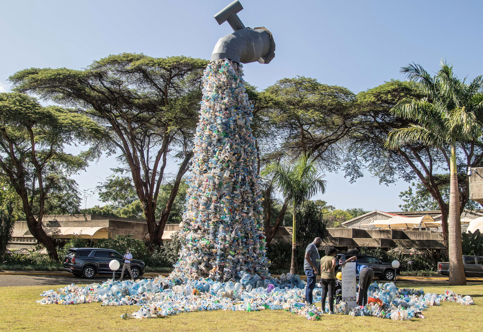 A huge spout spews plastic waste